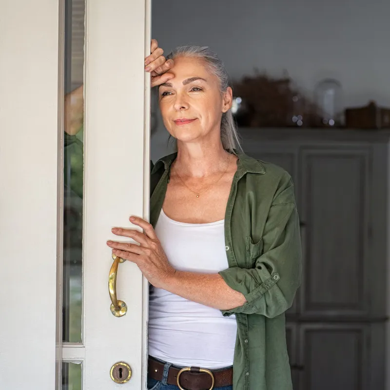 A woman looking outside the window. 