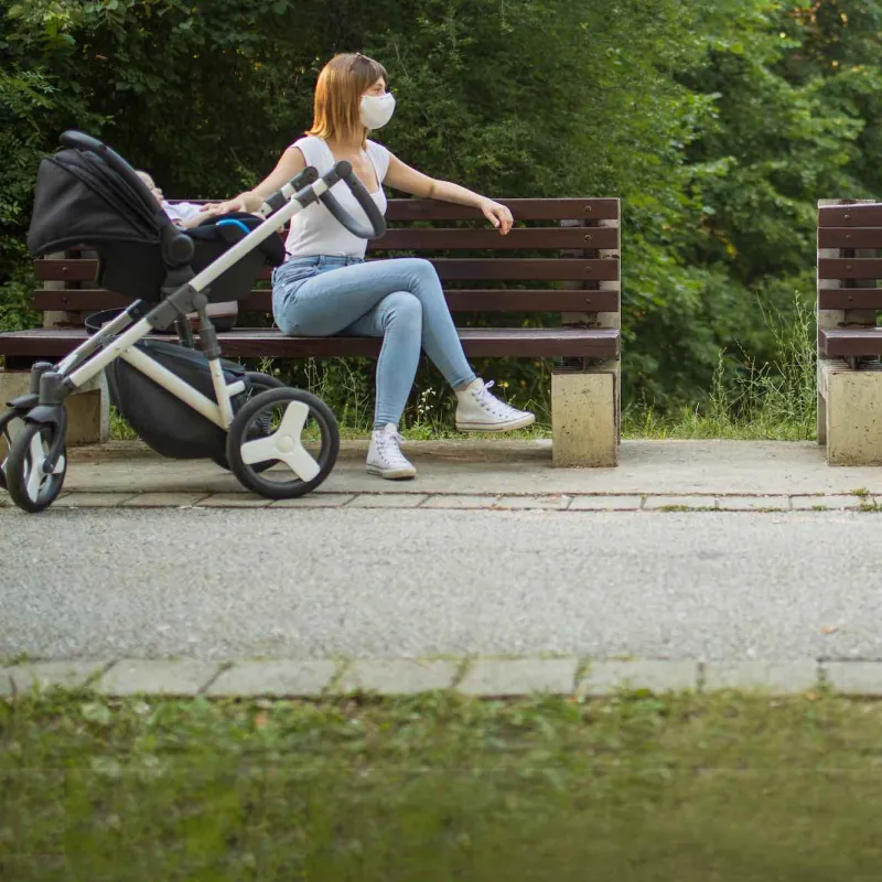 Two women social distancing outdoors.