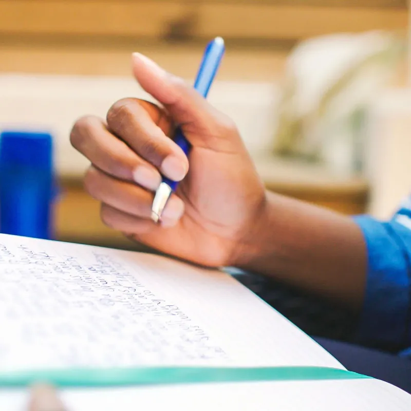 Woman writing in notebook