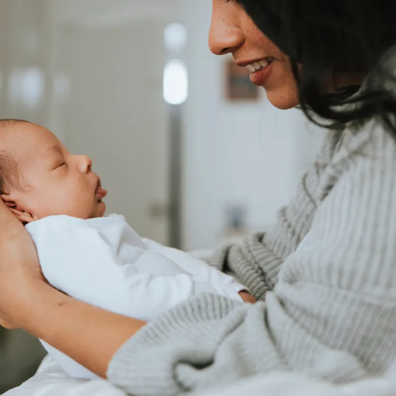 Mom holding infant