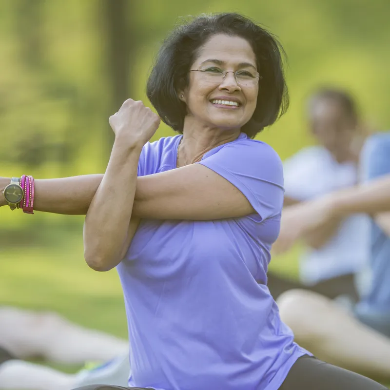 Woman stretching in a park