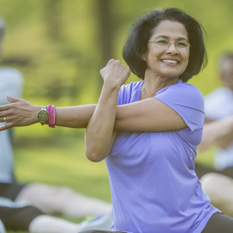 Woman stretching in a park