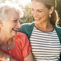 Woman hugging another woman