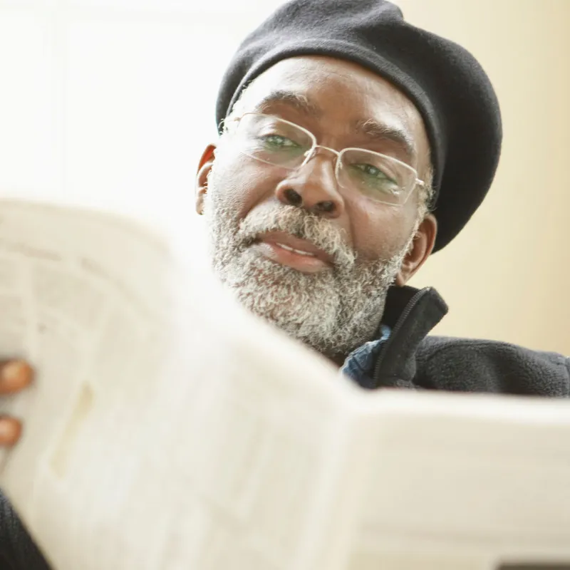 Man reading a newspaper.