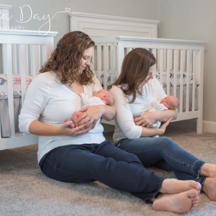 Meagan C and her wife holding her babies