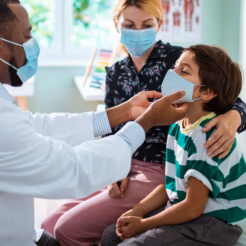 Mom and son in doctor's office