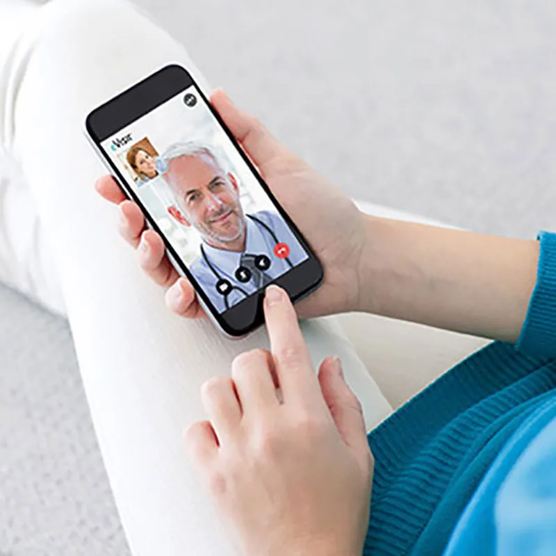 Patient talking to doctor with a smartphone.