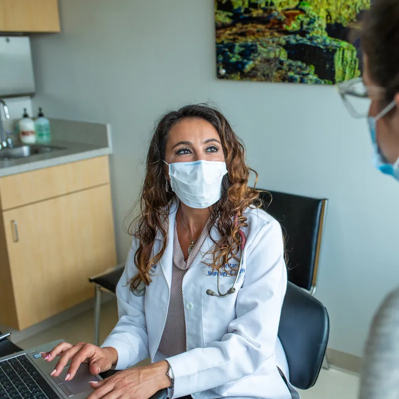 Physician talking with a patient.