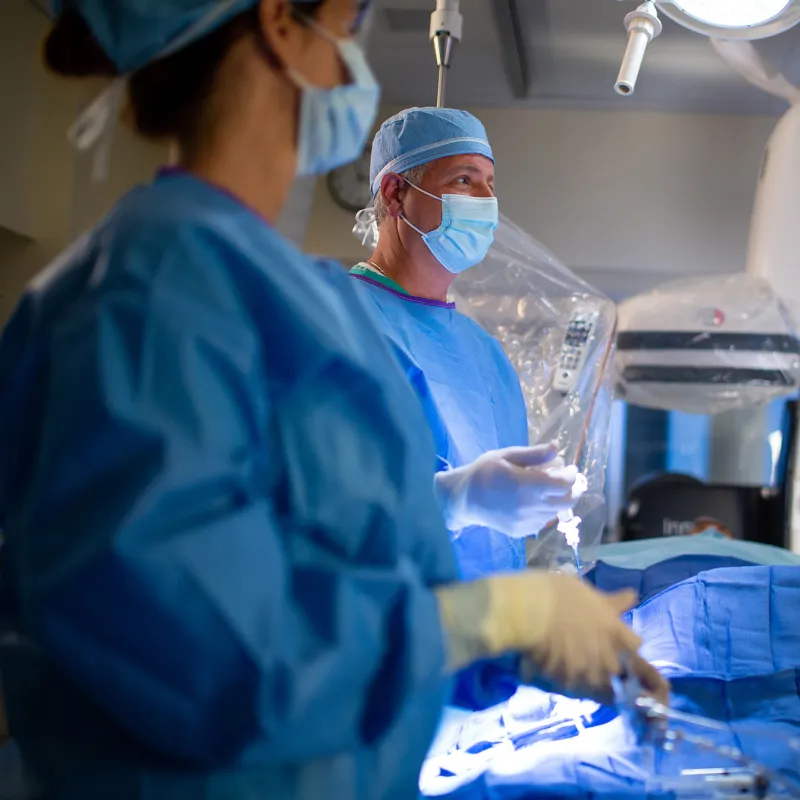 Neuro surgeon performing a procedure using a C-Arm.