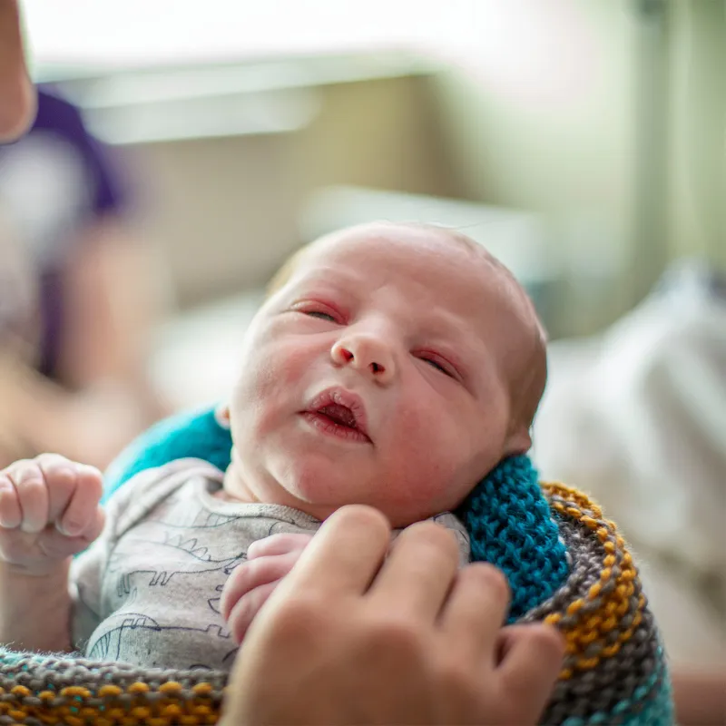 New mother holder her newborn baby.