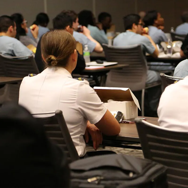 Professionals attending a conference in a Nicholson Center Eduction Center room.