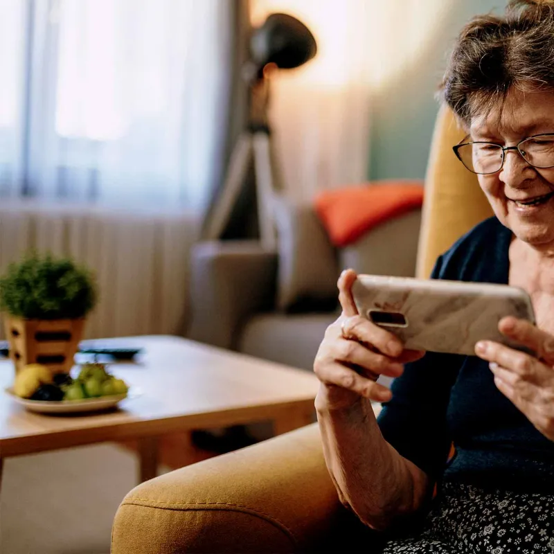 An older woman using video chat. 