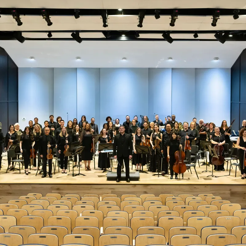 AdventHealth Orchestra on an indoor stage.