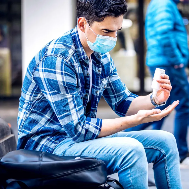 Person using hand sanitizer.