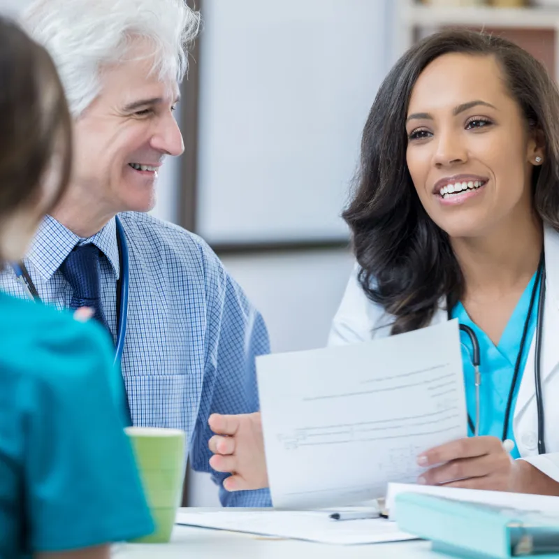 Two physicians interviewing job candidate