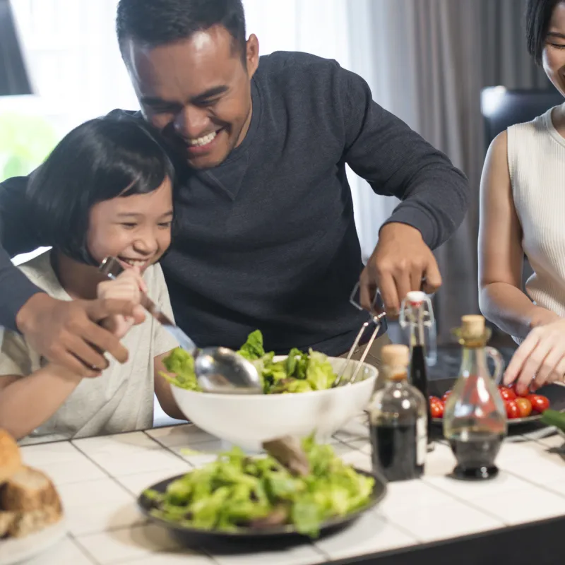 A family makes a meal together