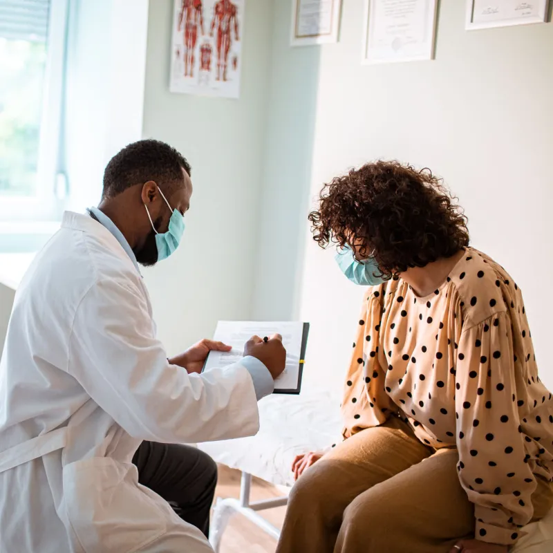 Provider and patient wearing masks in an office