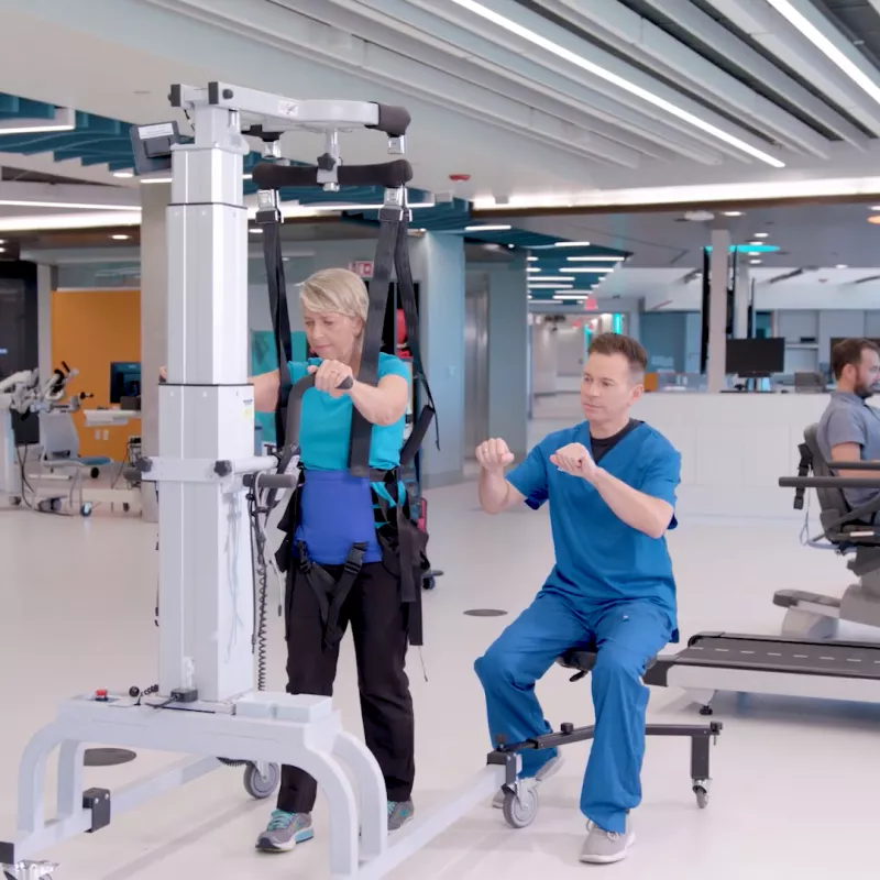 A Therapist Helps a Patient Through a Physical Therapy Session.