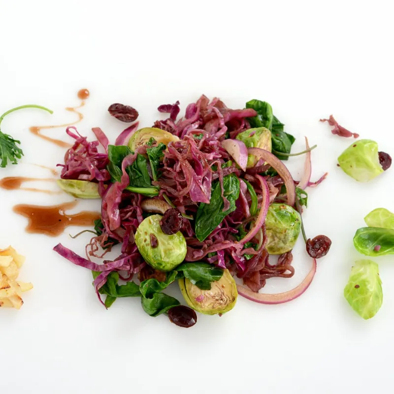 pile of Brussels sprouts, kale and chard in a balsamic vinaigrette 