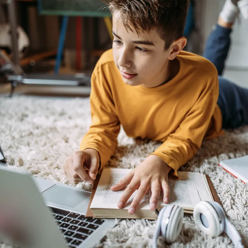 A teenage boy doing his homework.