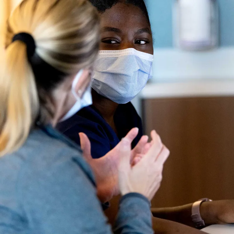 A doctor and patient discuss care needs.