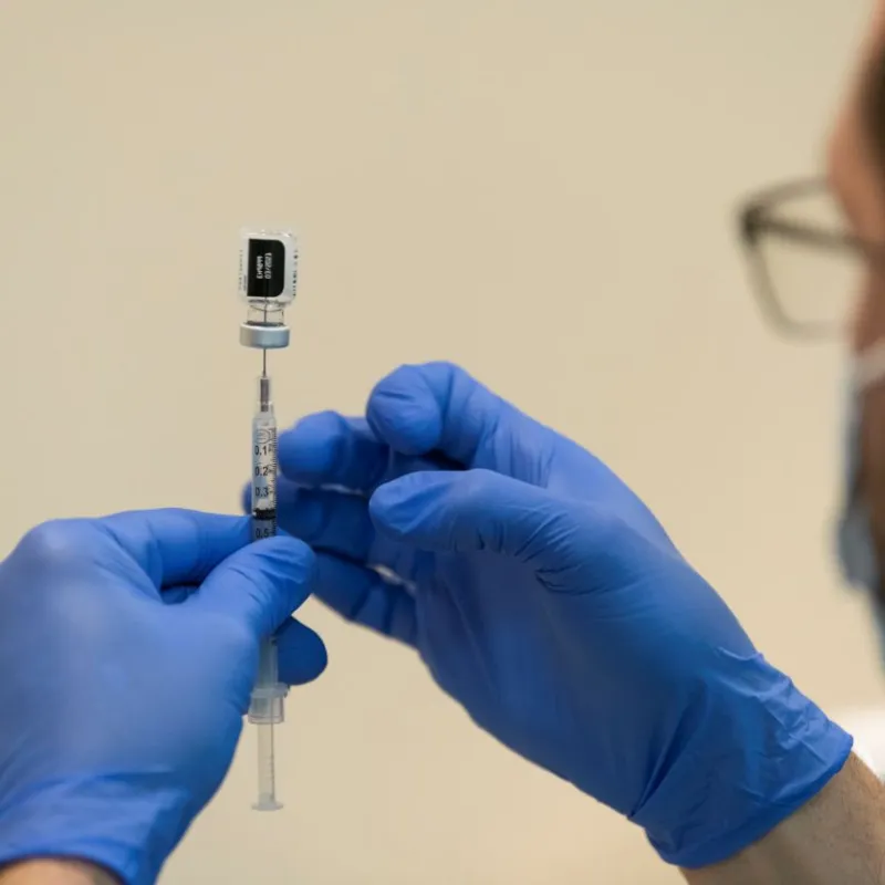 AdventHealth employee prepares vaccine.