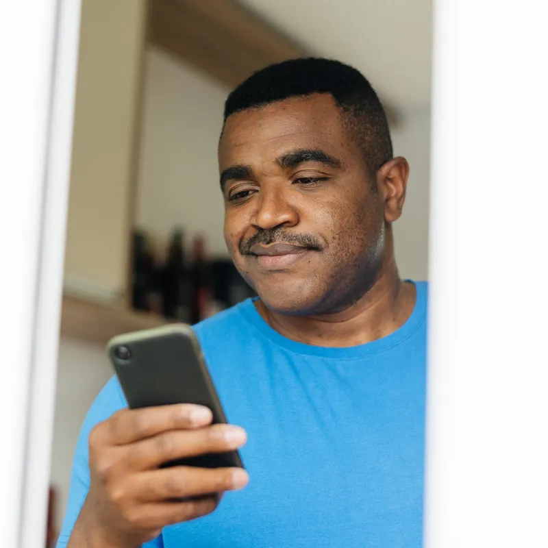 Man reading iPhone 