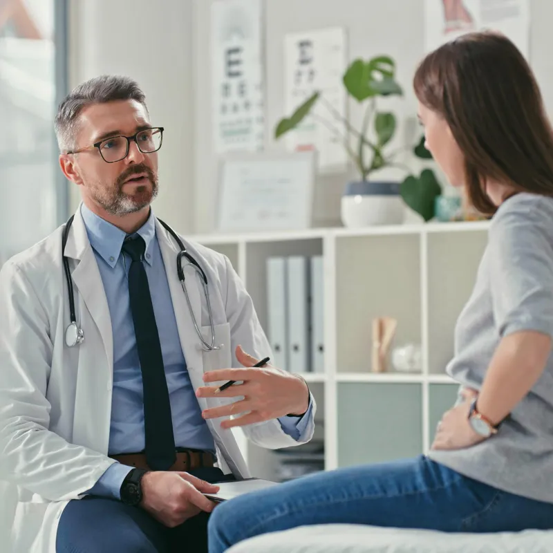 Female patient talking to male doctor