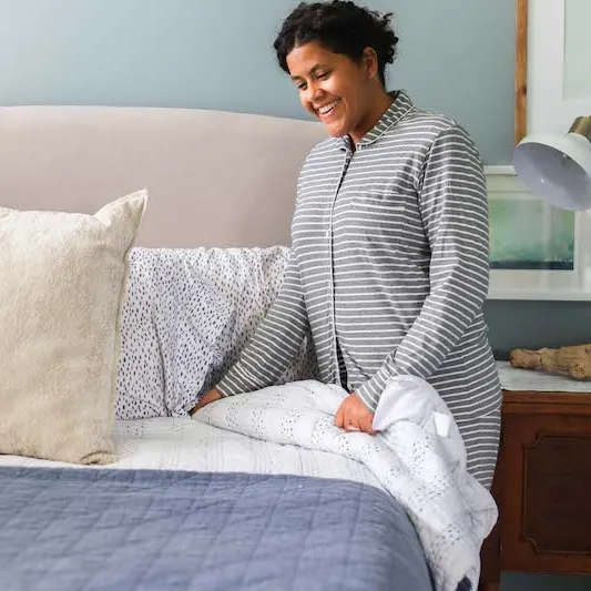 Woman making bed