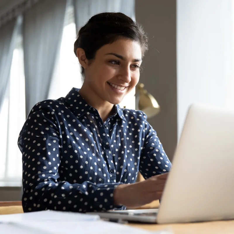 A woman using a laptop computer. 