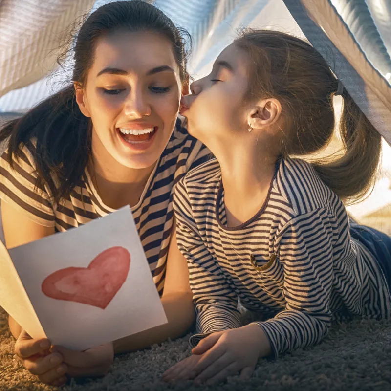 Mother and daughter laughing