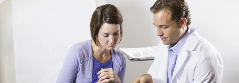 Woman reviewing chart with her doctor