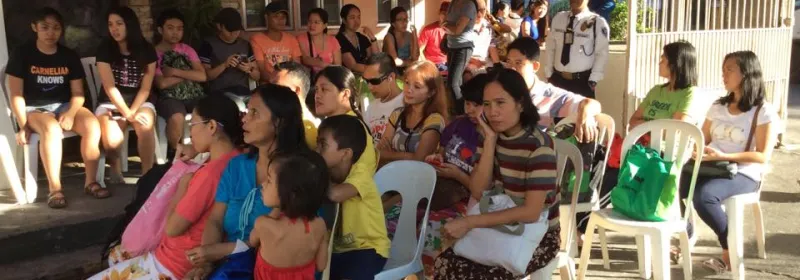 People sitting down for an event.
