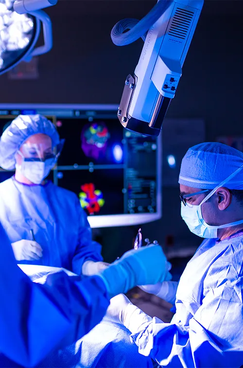 Neurology Physicians in lab performing surgery