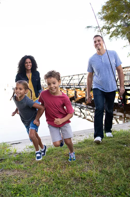 Hispanic Family Outdoors by the lake