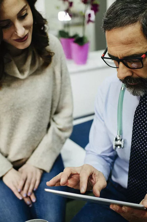 Woman discussing treatment with doctor