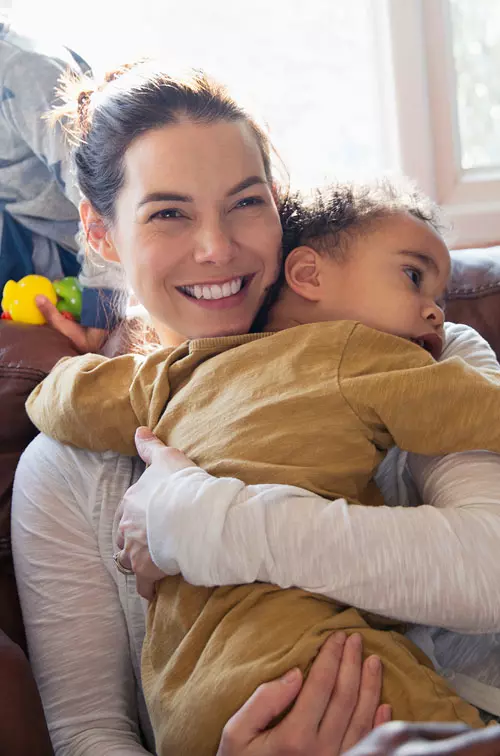 Mom hugging child