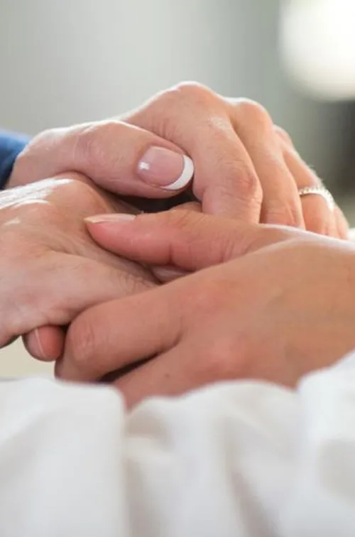 two people holding hands.