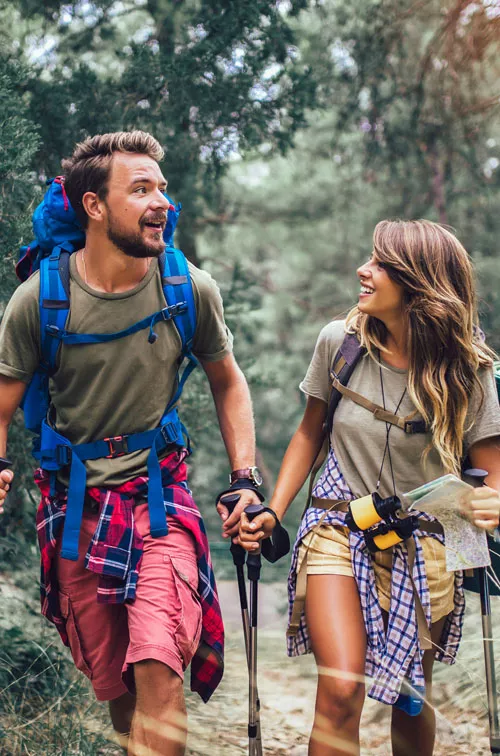 Young couple hiking in woods