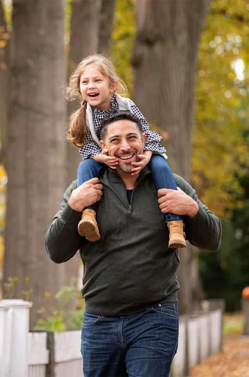 Father and Daughter walking outdoors