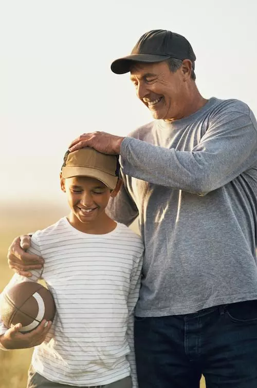 Father and Son Playing Football.