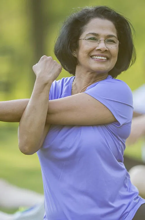 Woman stretching in a park