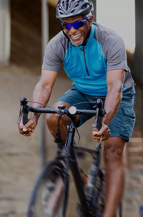 LP-Hero-Desktop-west-cv-vascular-senior-black-man-riding-bike