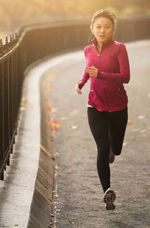 Woman Running on pathway