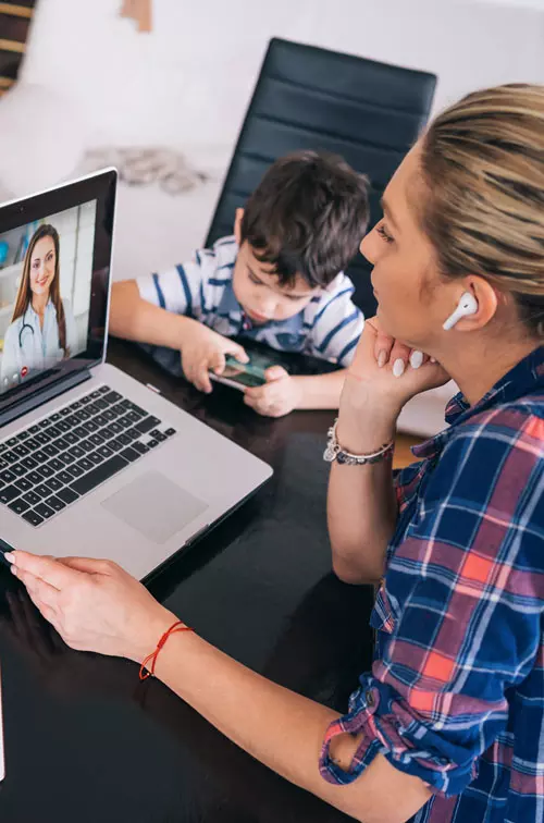 Mom on video visit with physician