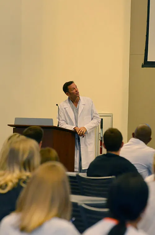 Man speaking at a conference.