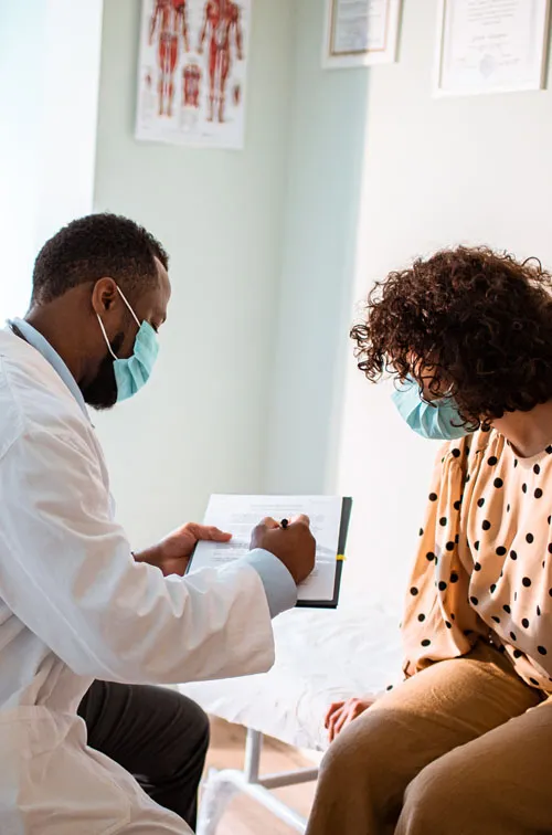 Provider and patient wearing masks in an office