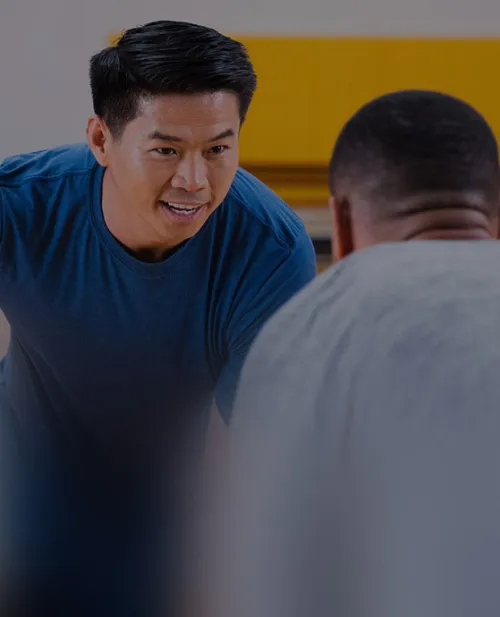 two men playing basketball