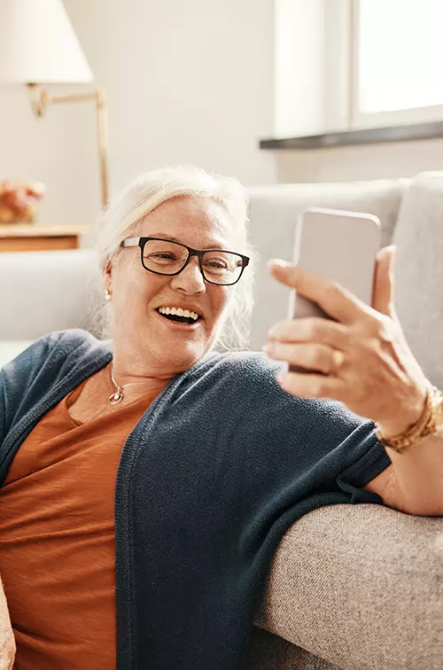 Woman taking a selfie with her living room.