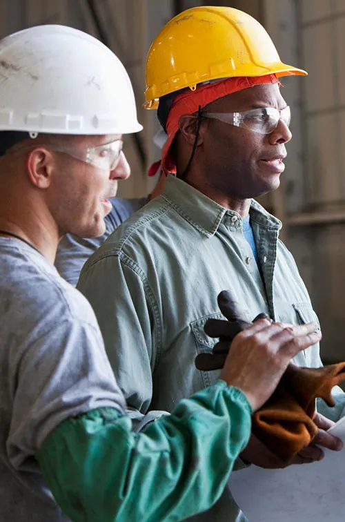 Workers discussing plans